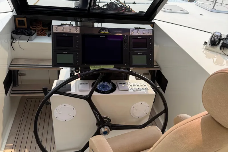 Slide: The Image of Cockpit of 2015 Gunboat 57' with navigation equipment and steering wheel. - 7