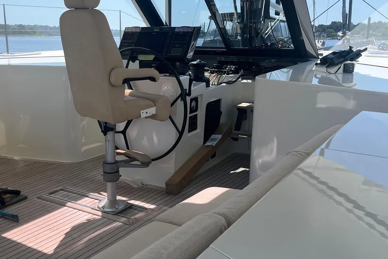 Slide: The Image of Helm station of 2015 Gunboat 57' yacht with modern controls and seating. - 8