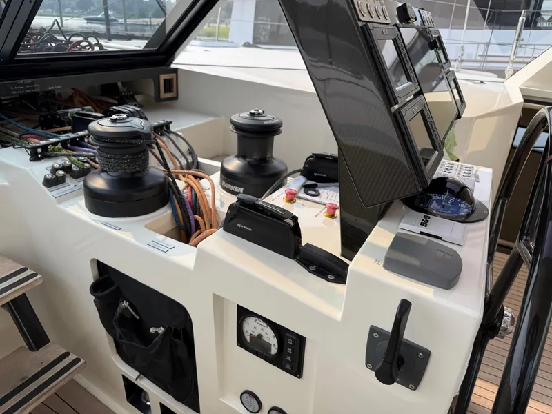 Slide: The Image of Control panel of a 2015 Gunboat 57' yacht with navigation instruments and winches. - 9