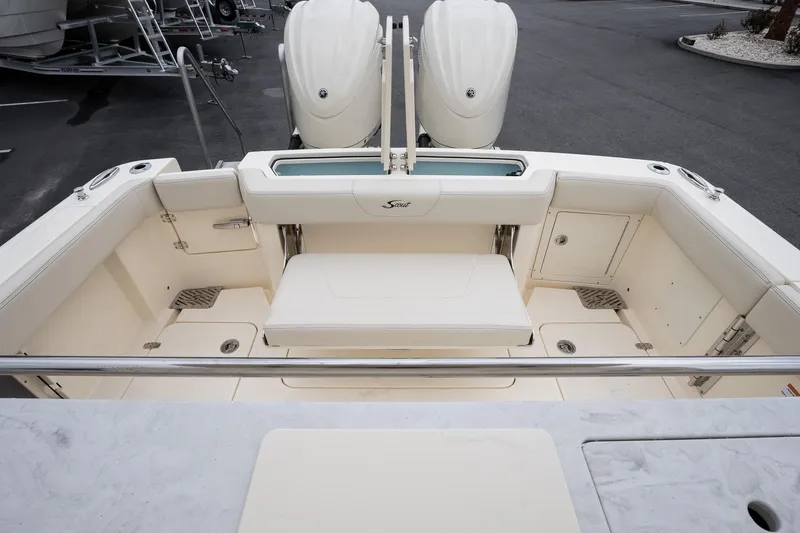 Slide: The Image of 2026 Scout 288 LXF boat interior with seating and storage compartments. - 13