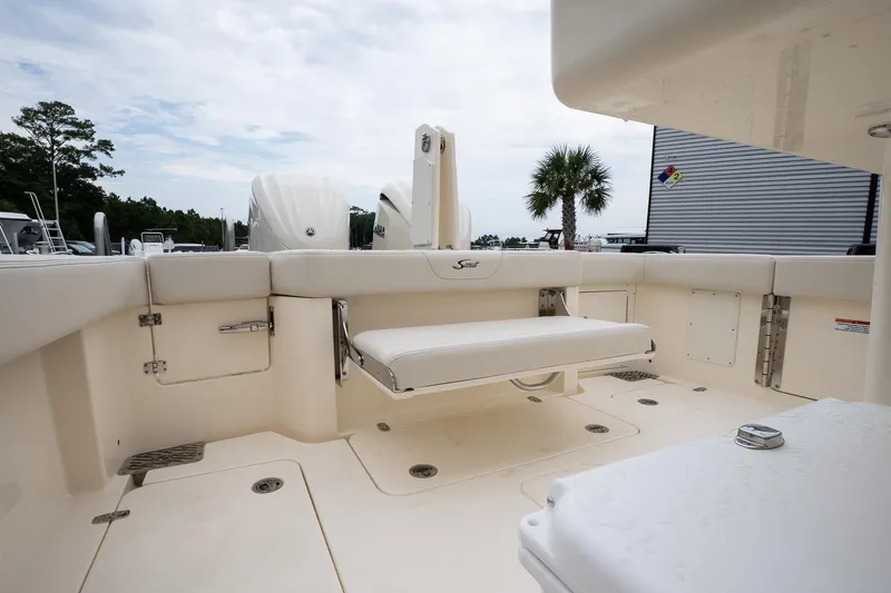 Slide: The Image of 2026 Scout 288 LXF boat interior with seating and storage compartments. - 15