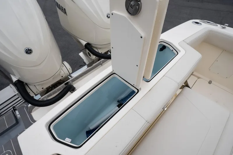 Slide: The Image of 2026 Scout 288 LXF boat with Yamaha engines and seating area. - 16