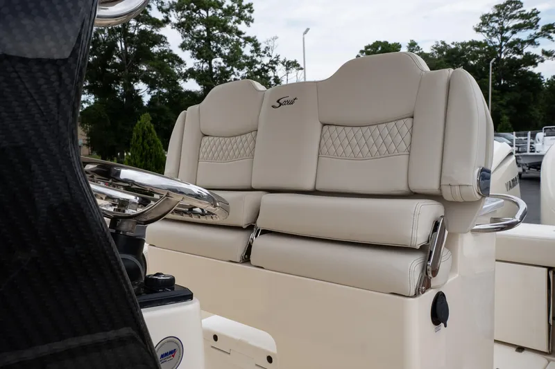 Slide: The Image of 2026 Scout 288 LXF boat with luxurious beige seating and steering wheel detail. - 49
