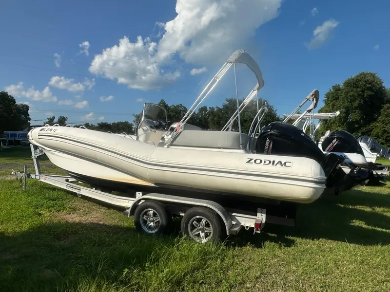 Slide: The Image of 2023 Zodiac N-ZO 680 boat on trailer under blue sky. - 1