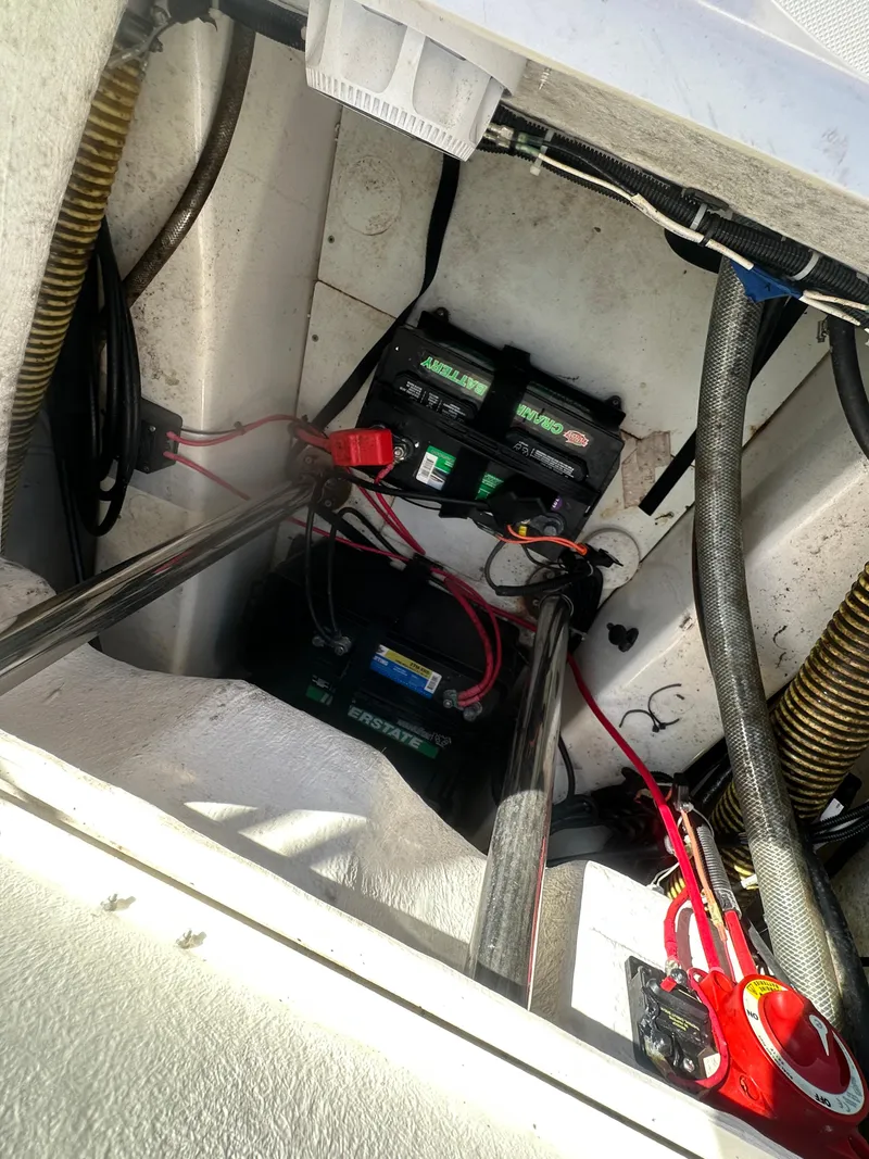 Slide: The Image of 2023 Zodiac N-ZO 680 boat battery compartment with wiring and components. - 13