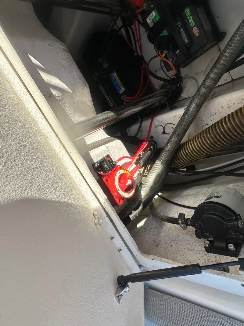Slide: The Image of 2023 Zodiac N-ZO 680 boat interior showing battery compartment and wiring. - 14