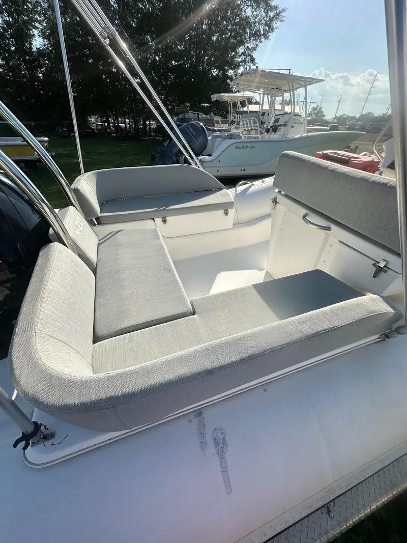 Slide: The Image of 2023 Zodiac N-ZO 680 boat interior with cushioned seating and sleek design. - 4