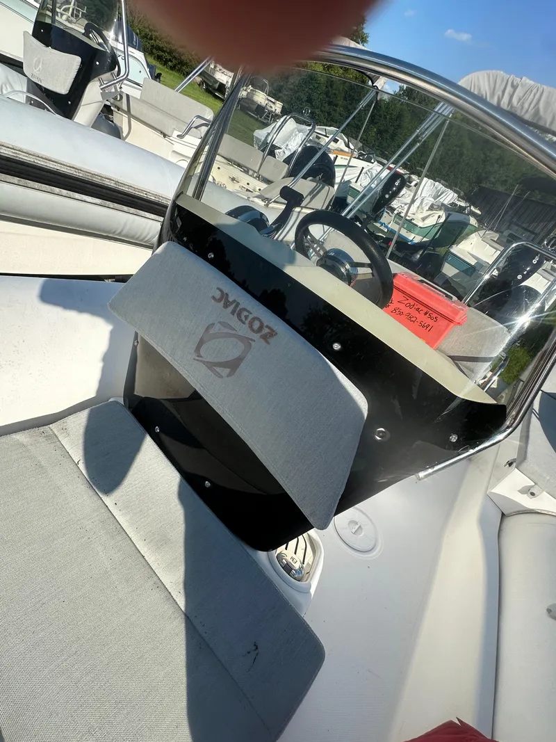 Slide: The Image of 2023 Zodiac N-ZO 680 boat interior with steering wheel and seating. - 9