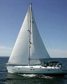 Slide: The Image of 1999 Beneteau 411 sailboat cruising on open water under clear skies. - 2