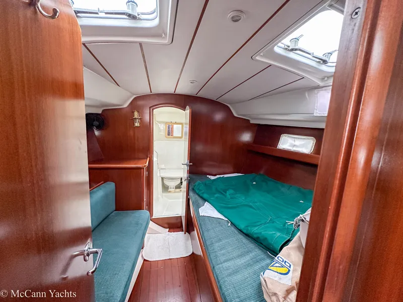 Slide: The Image of Cabin interior of 1999 Beneteau 411 yacht with bed and bathroom. - 20