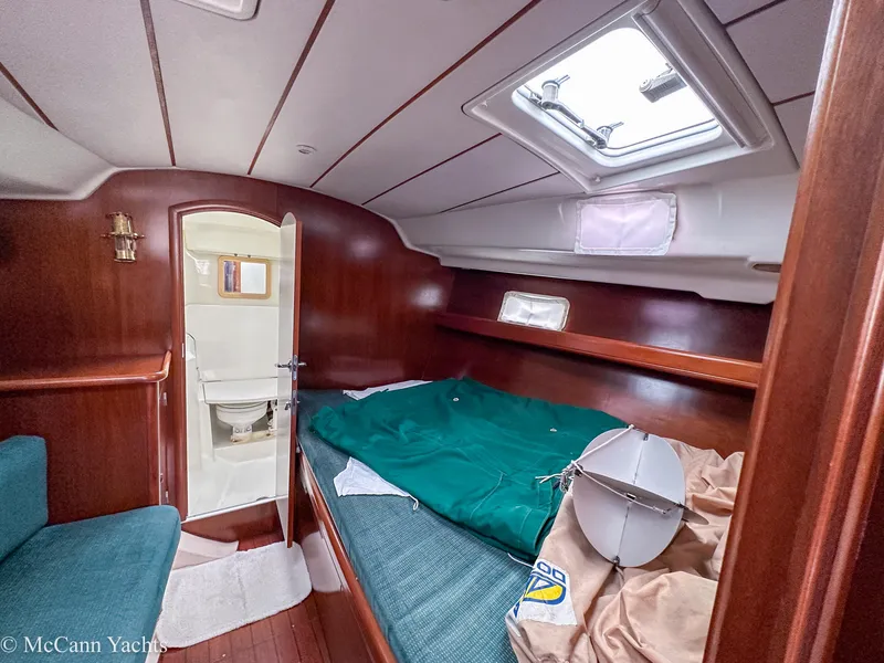 Slide: The Image of Interior cabin of 1999 Beneteau 411 yacht with bed and bathroom. - 21