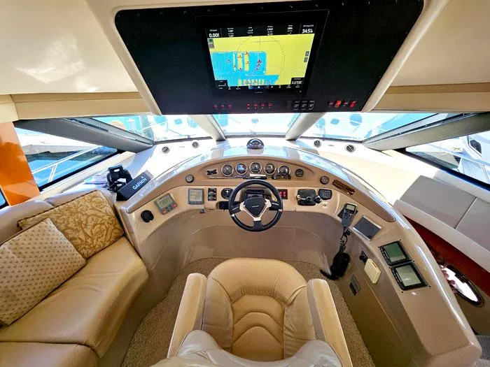 Slide: The Image of Luxurious helm of 2004 Carver 560 Voyager PH yacht with advanced navigation system. - 13