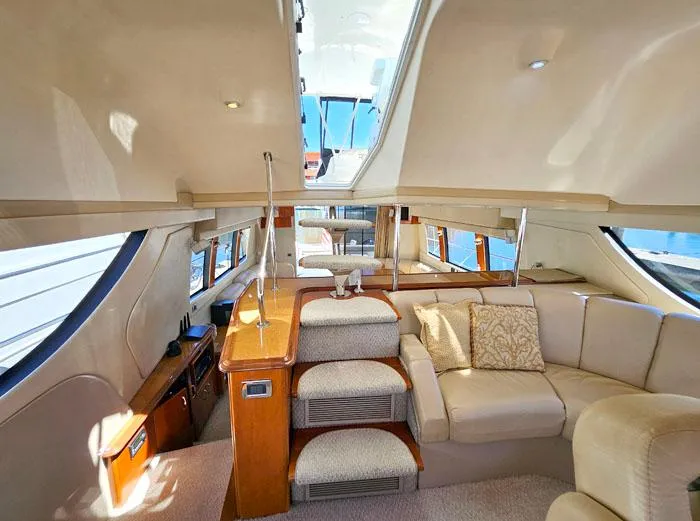 Slide: The Image of Luxurious interior of 2004 Carver 560 Voyager PH yacht with plush seating and elegant design. - 22
