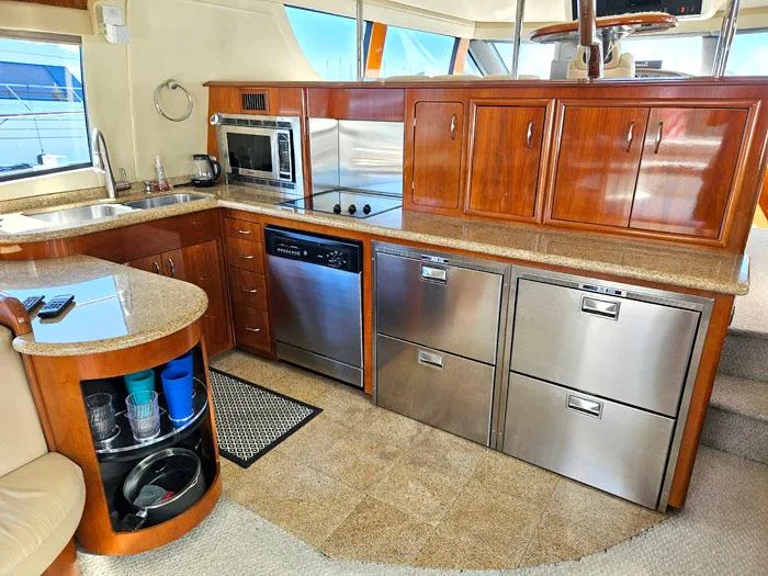 Slide: The Image of Luxurious kitchen interior of 2004 Carver 560 Voyager PH yacht with modern appliances. - 6