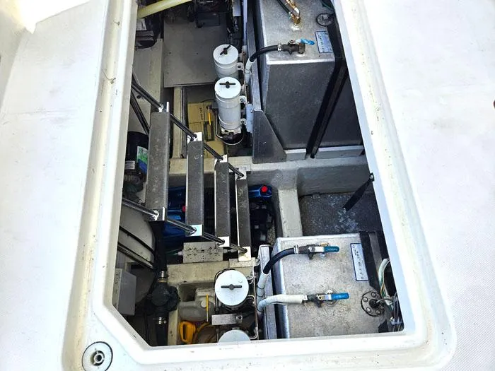 Slide: The Image of Engine compartment of 2004 Carver 560 Voyager PH yacht, showcasing mechanical components and systems. - 30