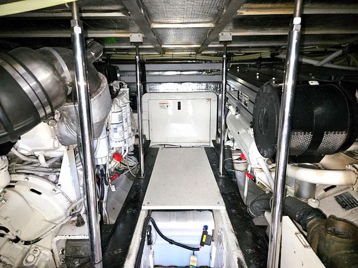 Slide: The Image of Engine room of 2004 Carver 560 Voyager PH yacht, showcasing mechanical components and systems. - 31