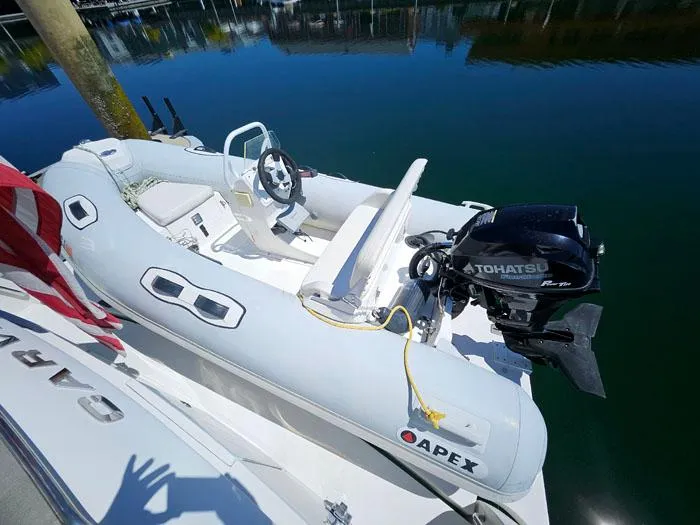 Slide: The Image of Inflatable boat with Tohatsu motor on Carver 560 Voyager PH, 2004 model. - 33
