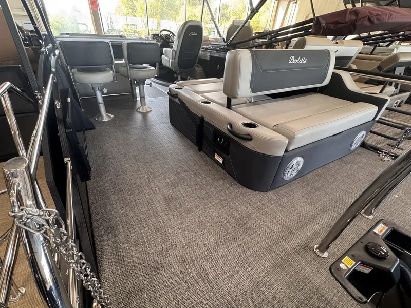 Slide: The Image of Interior of a 2026 Barletta Cabrio 24 UE with gray seating and carpeted floor. - 28