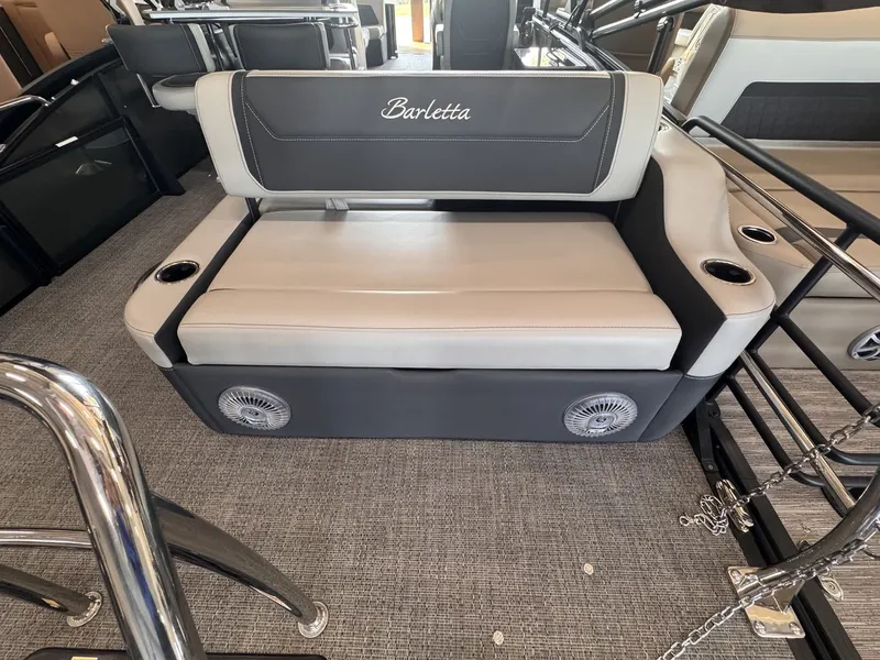 Slide: The Image of The 2026 Barletta Cabrio 24 UE features an elegant bench seat with cup holders and speakers. - 27
