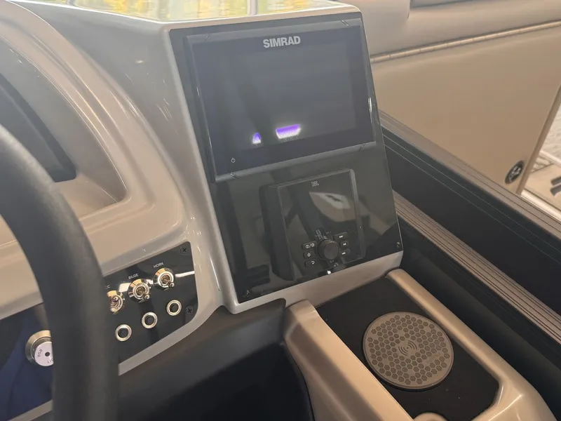 Slide: The Image of The image shows the dashboard of a 2026 Barletta Cabrio 24 UE with a Simrad display. - 15