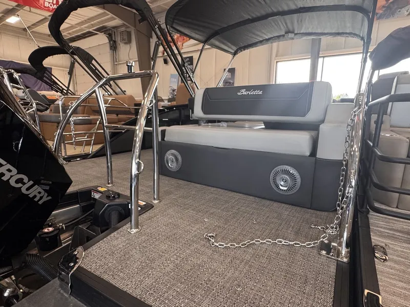 Slide: The Image of The image shows the deck of a 2026 Barletta Cabrio 24 UE with sleek seating. - 31