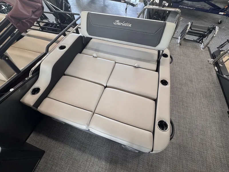 Slide: The Image of The image shows a luxurious lounging area on a Barletta Cabrio 24 UE boat. - 25