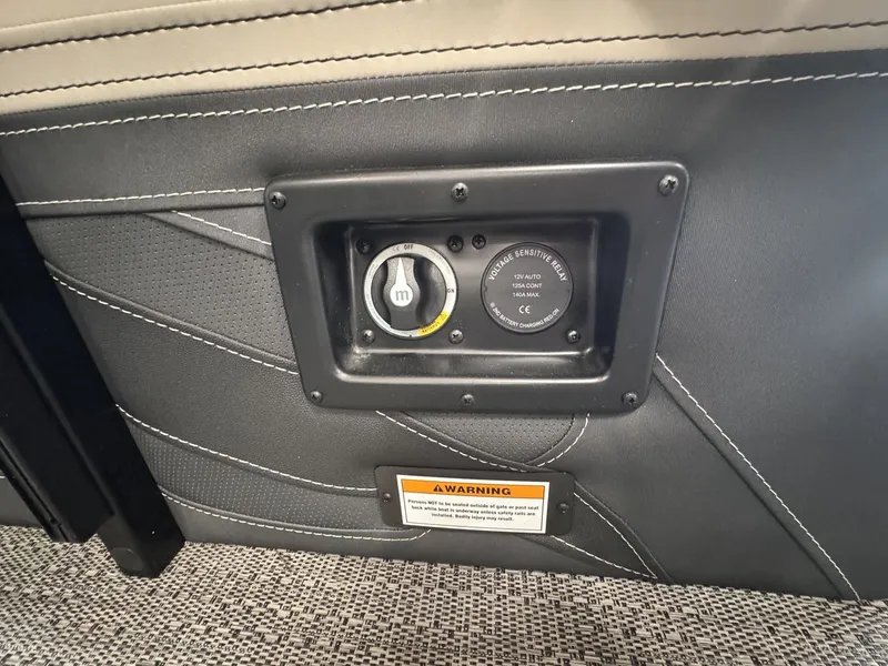 Slide: The Image of Close-up of a boat panel with power outlet and warning label. - 29