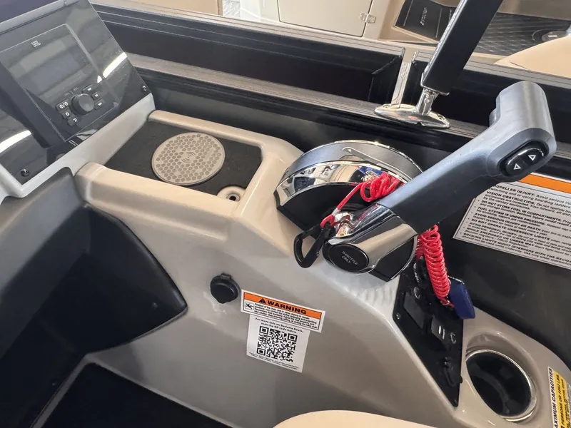 Slide: The Image of The image shows the helm of a Barletta Cabrio 24 UE boat with modern controls. - 16