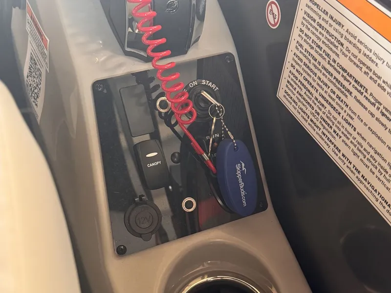Slide: The Image of Ignition keys and switches on a Barletta Cabrio 24 UE boat. - 18