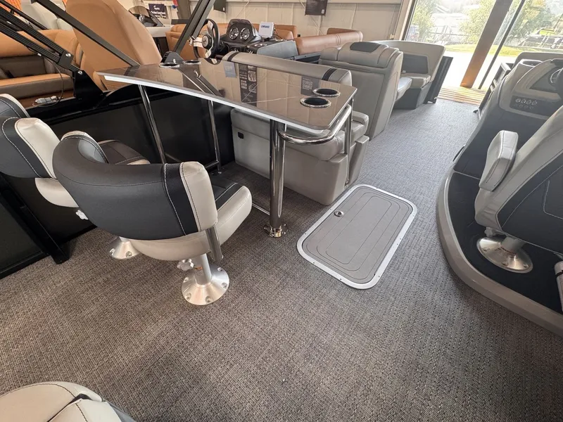 Slide: The Image of Interior of a 2026 Barletta Cabrio 24 UE with sleek seating and table. - 22