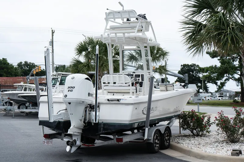Slide: The Image of 2019 Robalo 246 Cayman SD boat on trailer, featuring Yamaha 300 V6 engine. - 16