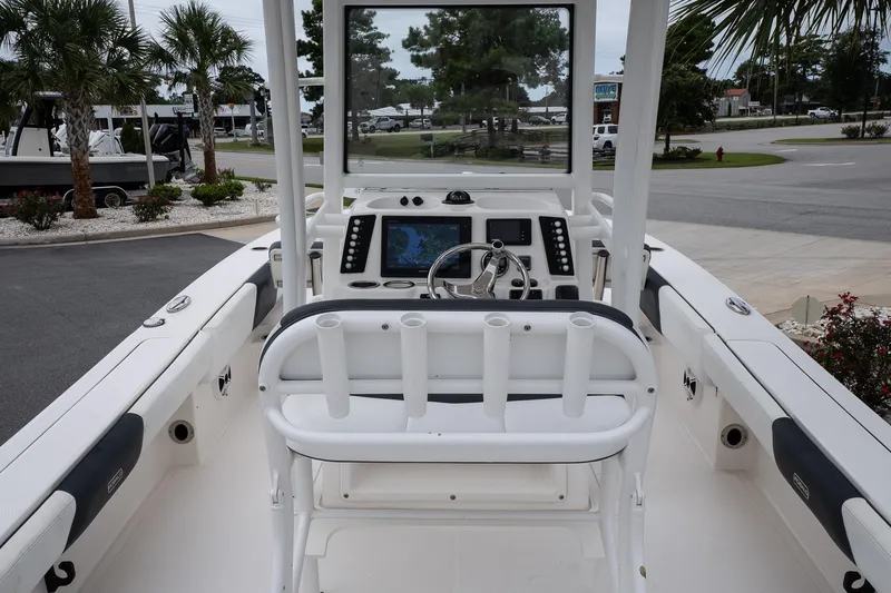 Slide: The Image of 2019 Robalo 246 Cayman SD boat interior with helm, steering wheel, and navigation display. - 24