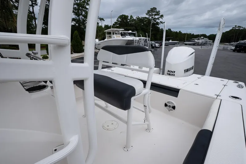 Slide: The Image of 2019 Robalo 246 Cayman SD boat interior with Yamaha 300 engine, featuring seating and deck details. - 27