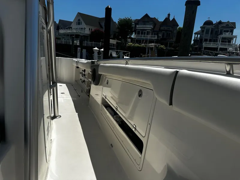 Slide: The Image of 2007 Robalo R300 Center Console boat docked near waterfront homes. - 10