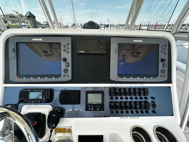 Slide: The Image of 2007 Robalo R300 Center Console dashboard with navigation and control systems. - 16
