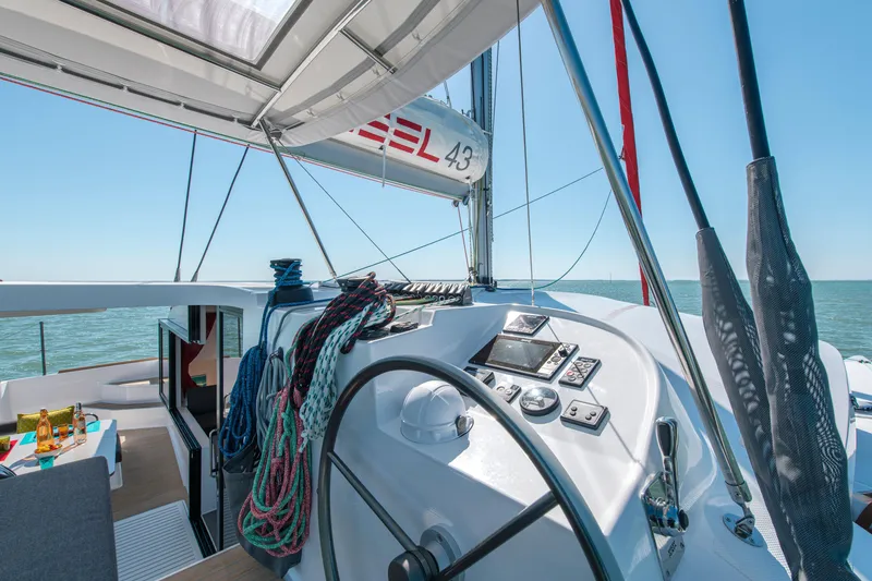 Slide: The Image of Sailing yacht NEEL 43, 2025 model, with modern cockpit and ocean view. - 2