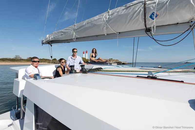 Slide: The Image of People enjoying a sunny day on a 2025 NEEL 47 trimaran sailboat. - 15