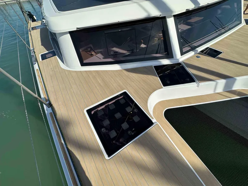 Slide: The Image of Modern NEEL 52 trimaran deck with sleek design and large windows, 2025 model. - 7