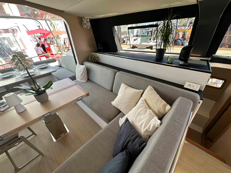 Slide: The Image of Luxurious interior of 2025 NEEL 52 yacht with modern seating and dining area. - 9