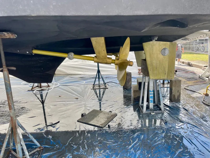 Slide: The Image of 2000 Offshore Yachts Pilothouse underbody with propeller and rudder on stands. - 20