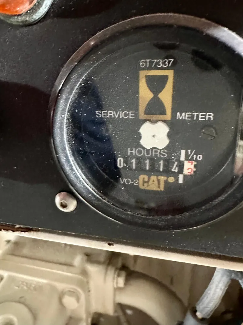 Slide: The Image of Hour meter on 2000 Offshore Yachts Pilothouse, showing 1114 hours. - 24