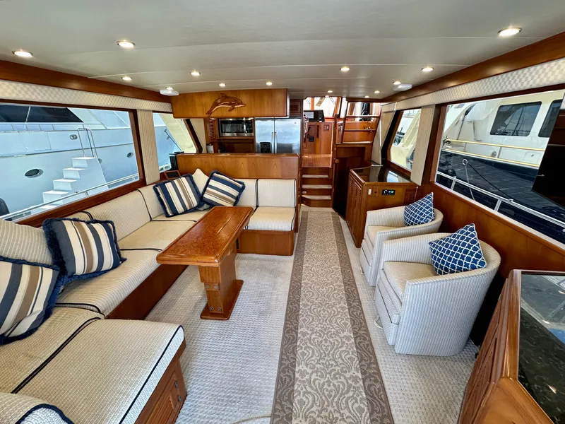 Slide: The Image of Luxurious interior of a 2000 Offshore Yachts Pilothouse with elegant seating and wooden accents. - 10