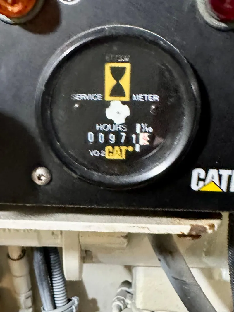 Slide: The Image of Hour meter on 2000 Offshore Yachts Pilothouse, showing 971 hours, CAT engine. - 25