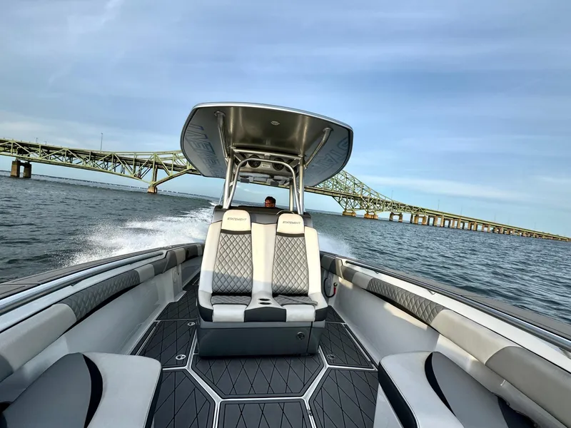 Slide: The Image of 2019 Statement 350 Open boat cruising near a bridge on a sunny day. - 11