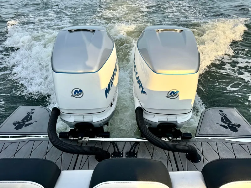 Slide: The Image of 2019 Statement 350 Open boat with dual Mercury outboard engines on water. - 14