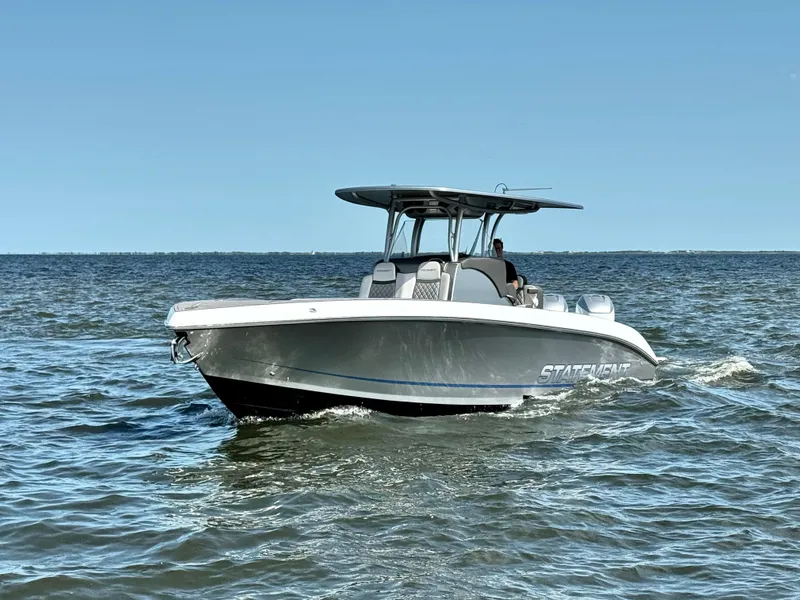 Slide: The Image of 2019 Statement 350 Open boat cruising on open water under clear blue sky. - 2