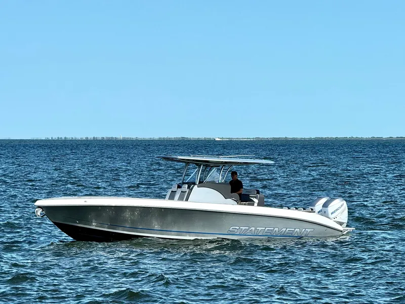 Slide: The Image of 2019 Statement 350 Open boat cruising on open water under clear blue sky. - 3