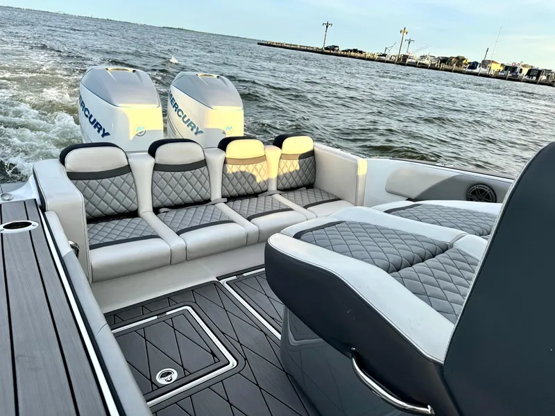 Slide: The Image of Luxurious 2019 Statement 350 Open boat with plush seating and dual Mercury engines. - 6
