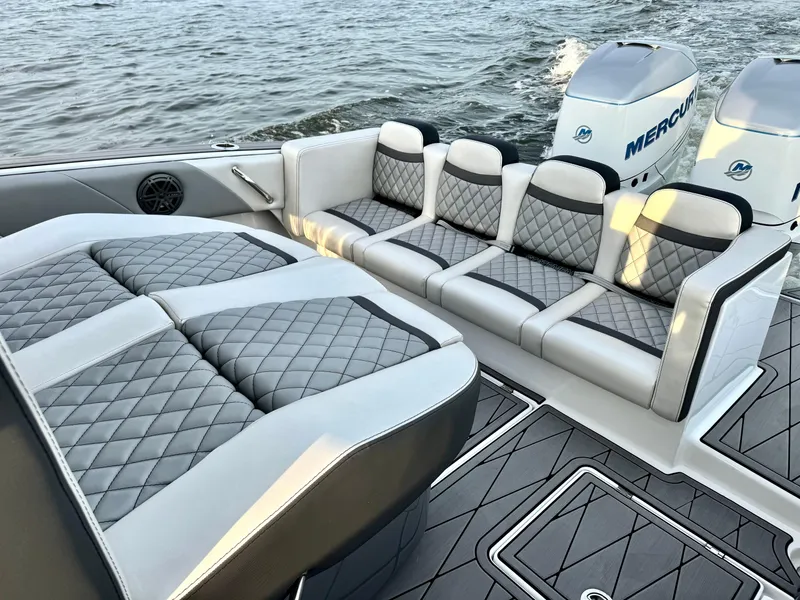 Slide: The Image of Luxury seating on 2019 Statement 350 Open boat with dual Mercury engines. - 7