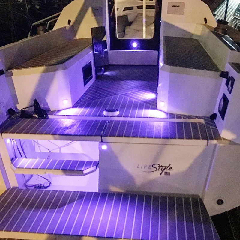 Slide: The Image of 2025 Faro Yachts 29 with illuminated deck and modern interior design. - 10